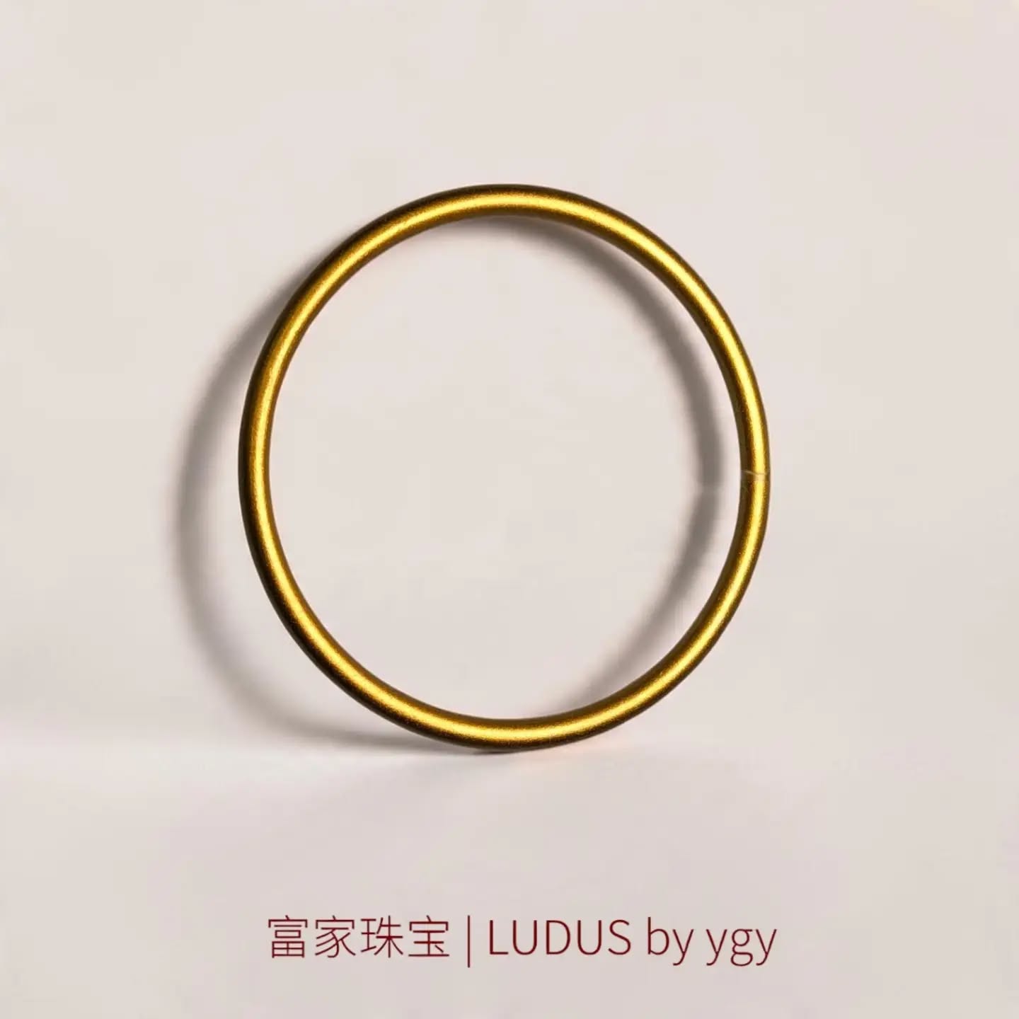 Elegant Circular Gold Bangle