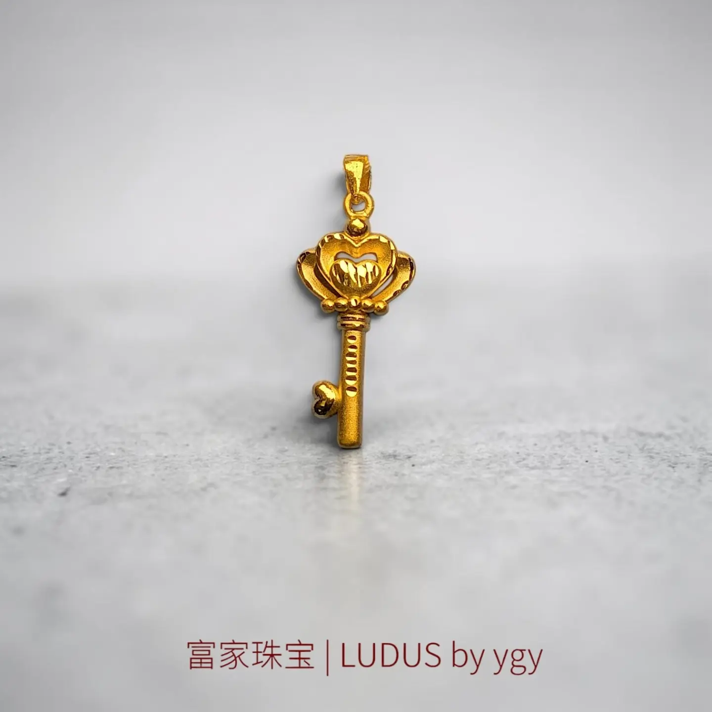 Elegant Key Motif Gold Pendant